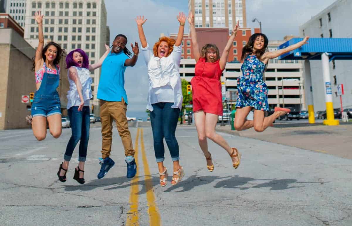 Clary Sage College students jumping up in Downtown Tulsa, OK
