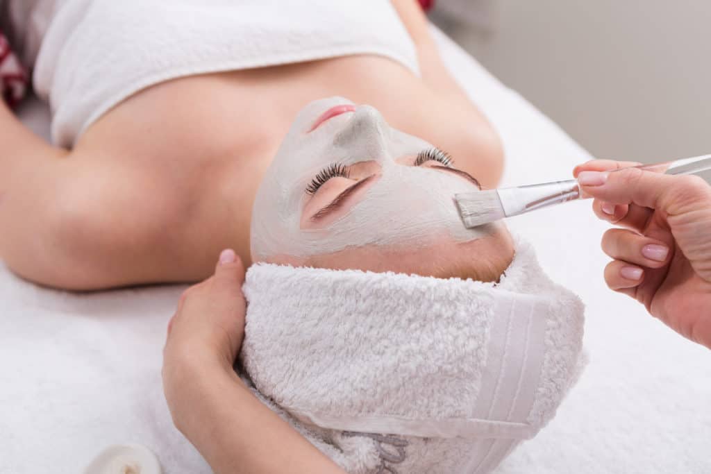 Clary Esthetician Student Applying Face Mask